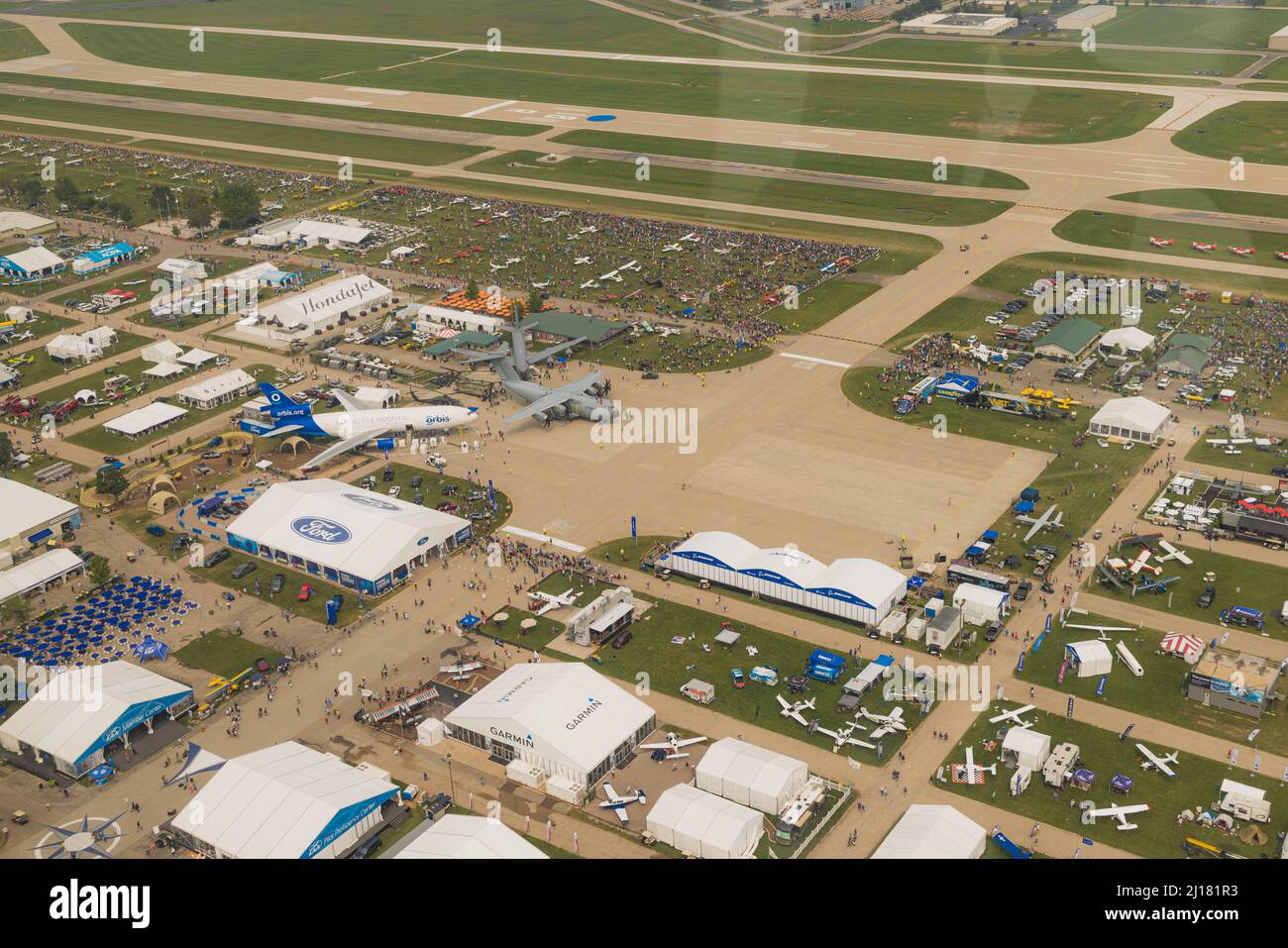 An aerial view of EAA Airventure grounds with planes and tents Stock
