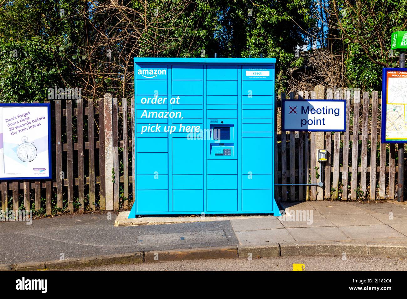 Blue Amazon Hub Locker outside a train station (Baldock, UK Stock Photo