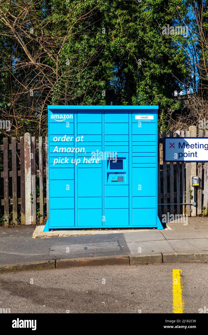 Blue Amazon Hub Locker outside a train station (Baldock, UK) Stock Photo
