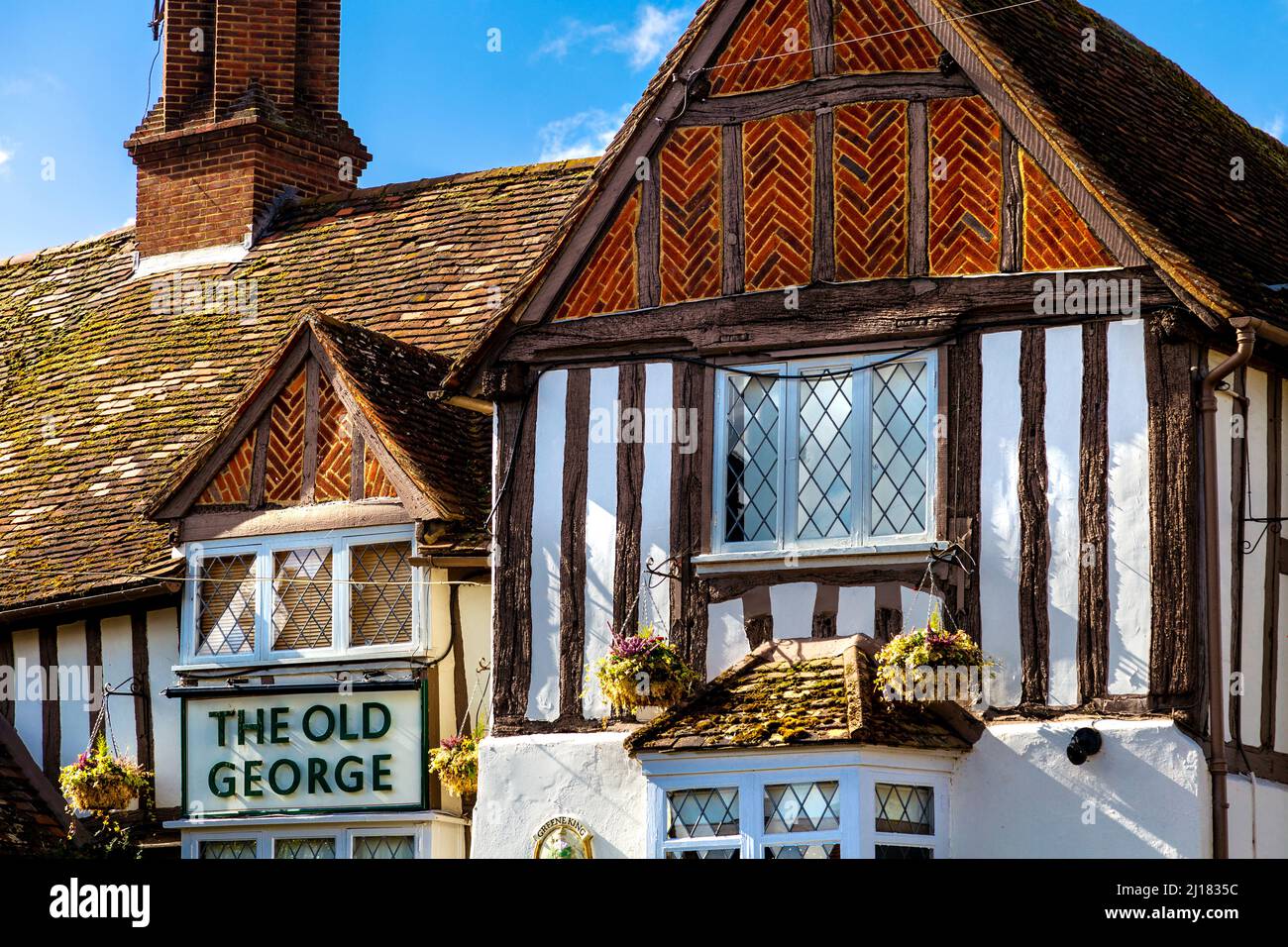 Exterior of The Old George pub originally built by Gilbertine Monks in early 12th century in the village of Ickleford near Hitchin, Hertfordshire, UK Stock Photo