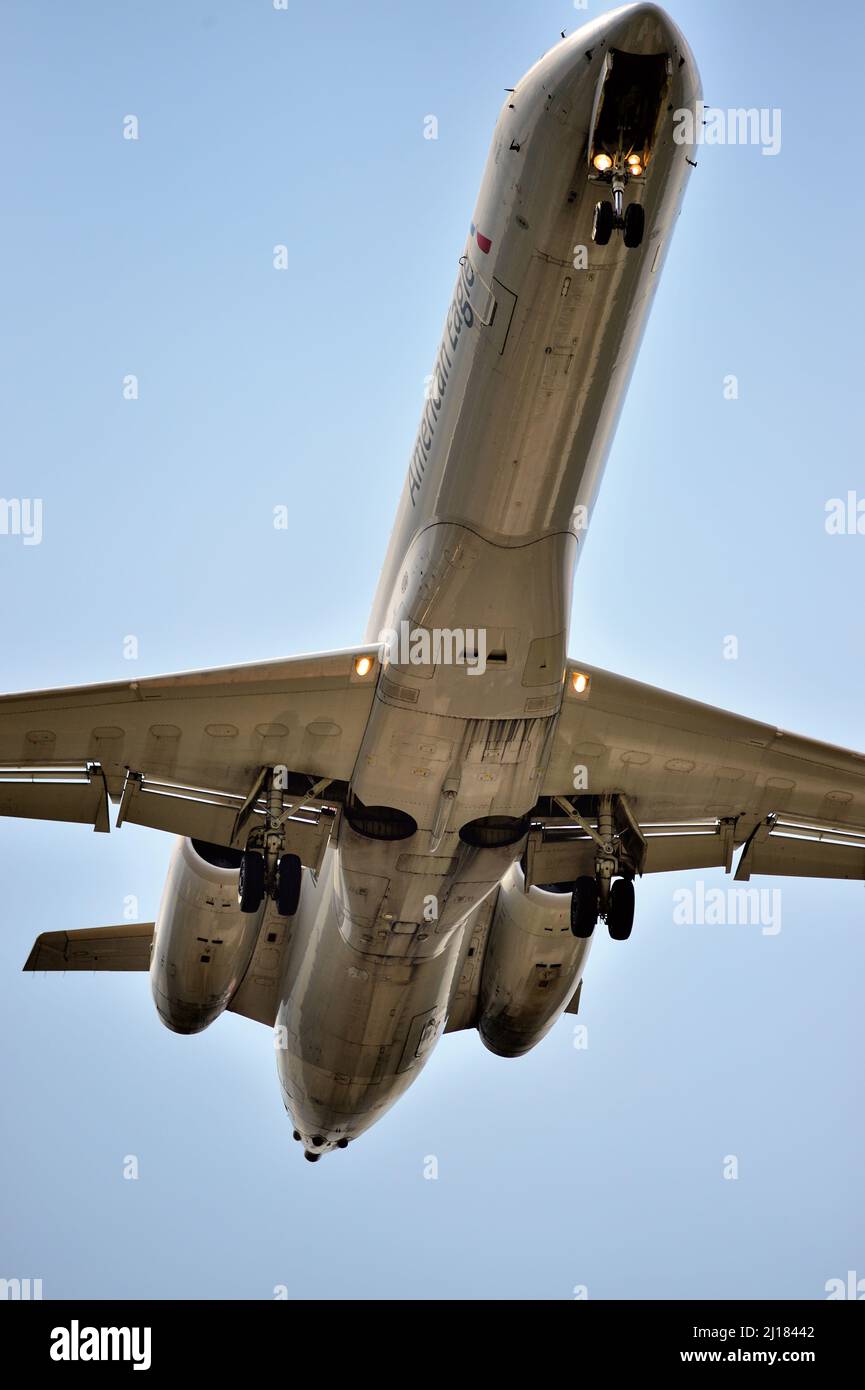 Chicago, Illinois, USA. An American Eagle passenger jet, with its landing gear down, makes its final approach to O'Hare International Airport. Stock Photo