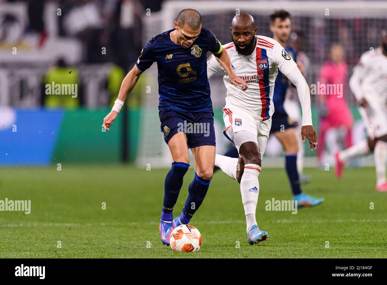 Lyon, France - March 17: Pepe Ferreira of FC Porto (L) is chased by Moussa Dembele of Lyon (R) during the UEFA Europa League Round of 16 Leg Two match Stock Photo