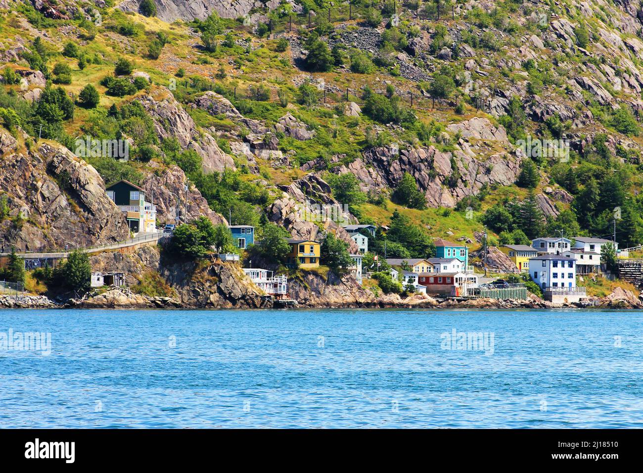 Houses along the water's edge, at the base of Signal Hill, St. John's Harbour, The Battery, St. John's, NL Stock Photo