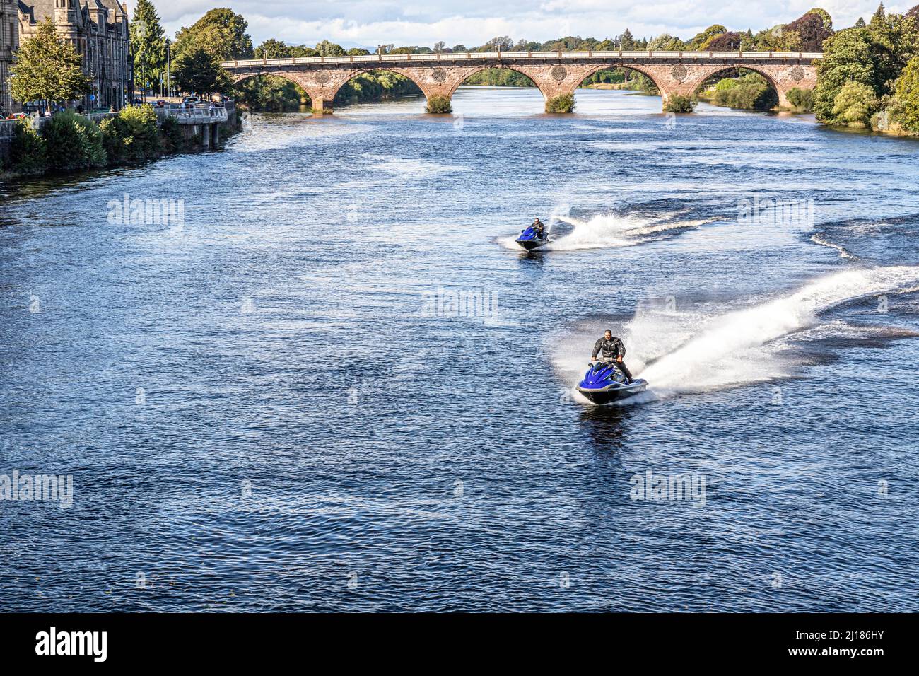 Jetskiing on the River Tay on a peaceful Sunday afternoon in the centre of the city of Perth, Perth and Kinross, Scotland UK Stock Photo