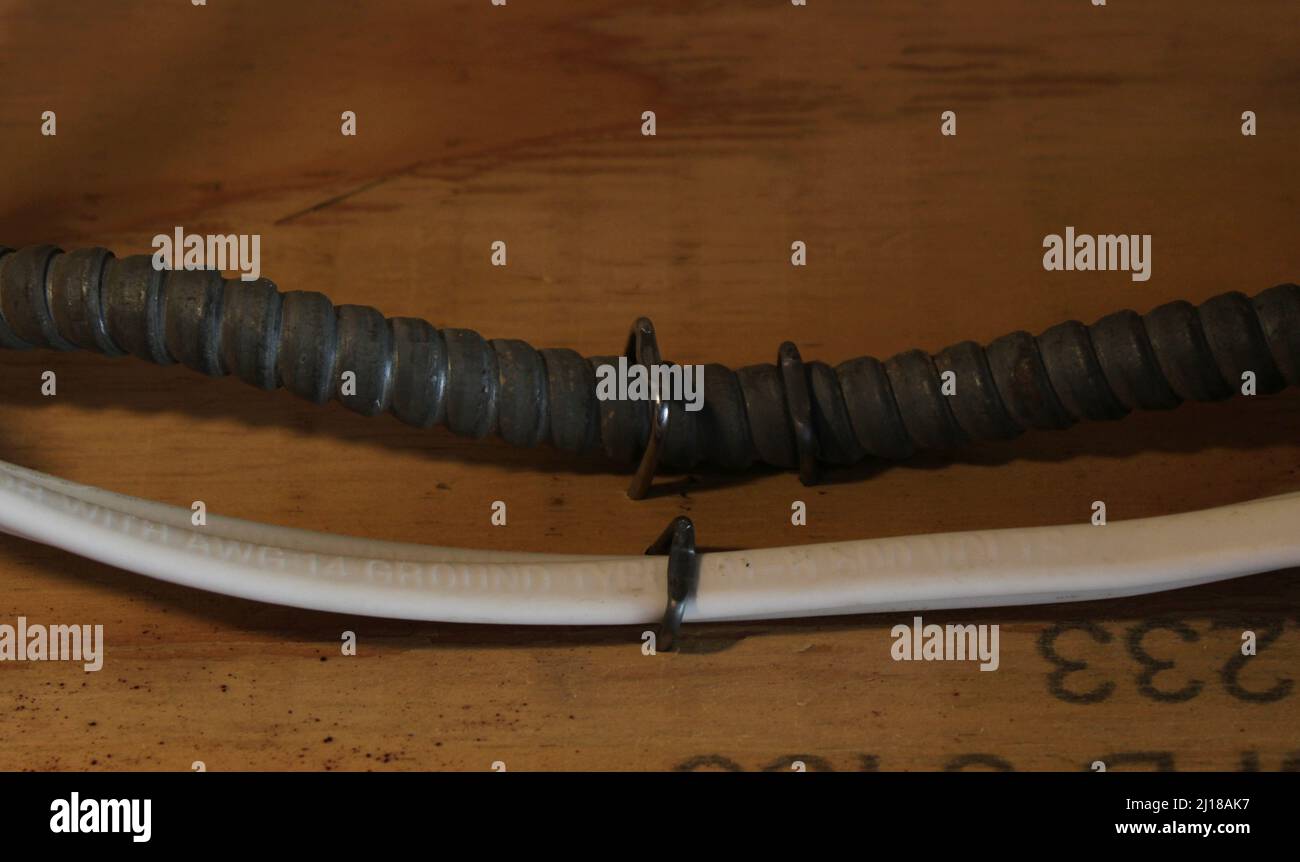 Two Electrical Wires Stapled to a Wooden Joist Stock Photo Alamy