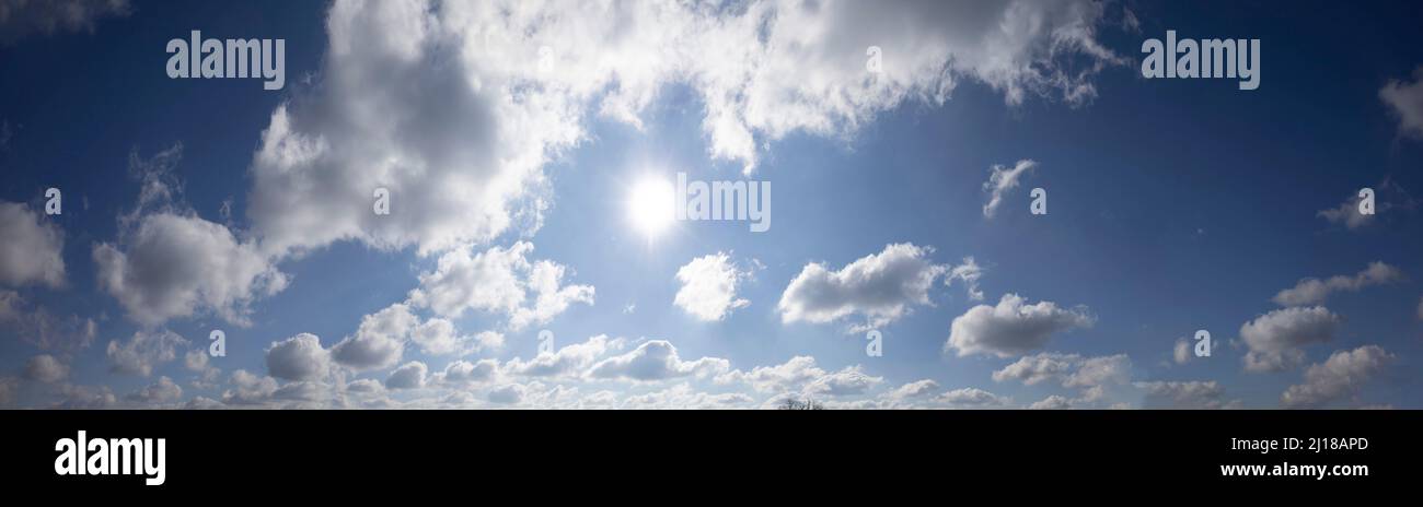 Panorama of blue sky with fluffy white clouds Stock Photo - Alamy