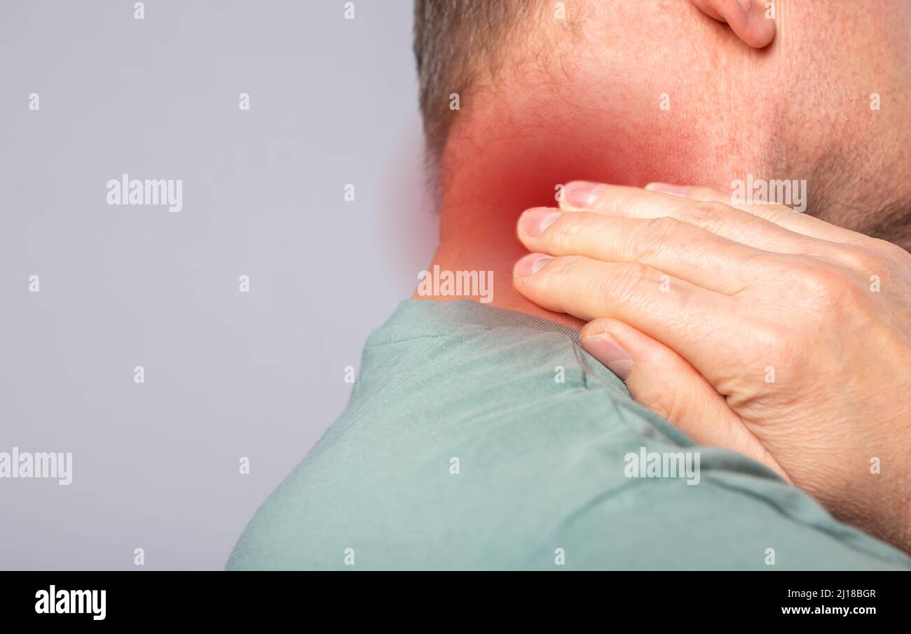 Neck pain closeup. Abstarct man suffering from injury, strain, discomfort, ache. photo Stock Photo