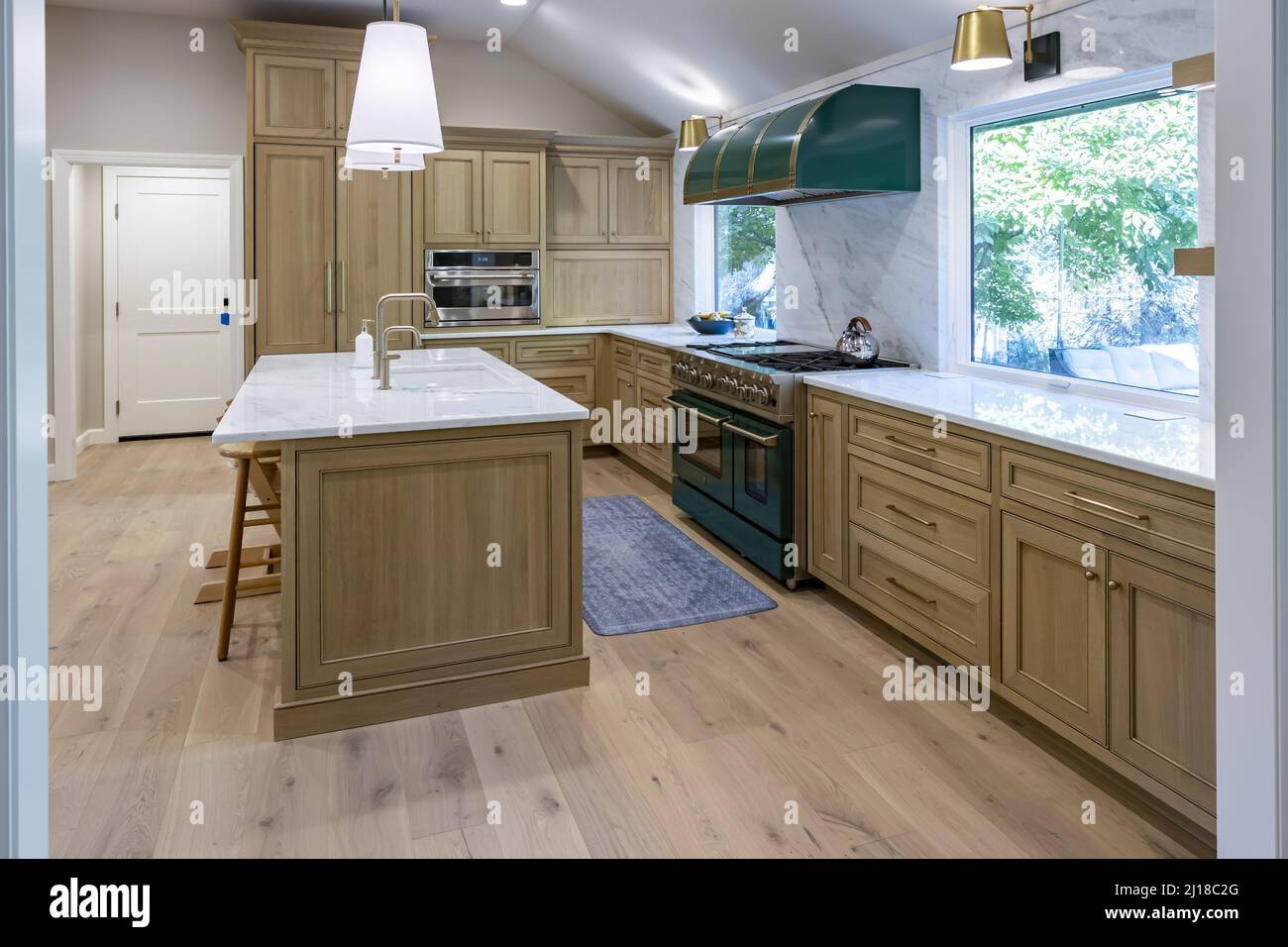 The kitchen of a classic house with wooden and marble counters and island Stock Photo