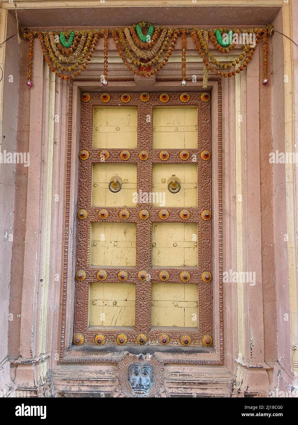 21 March 2022, Pandharpur, India, Old Vintage wooden door on retro wall, Pandharpur, India. Stock Photo