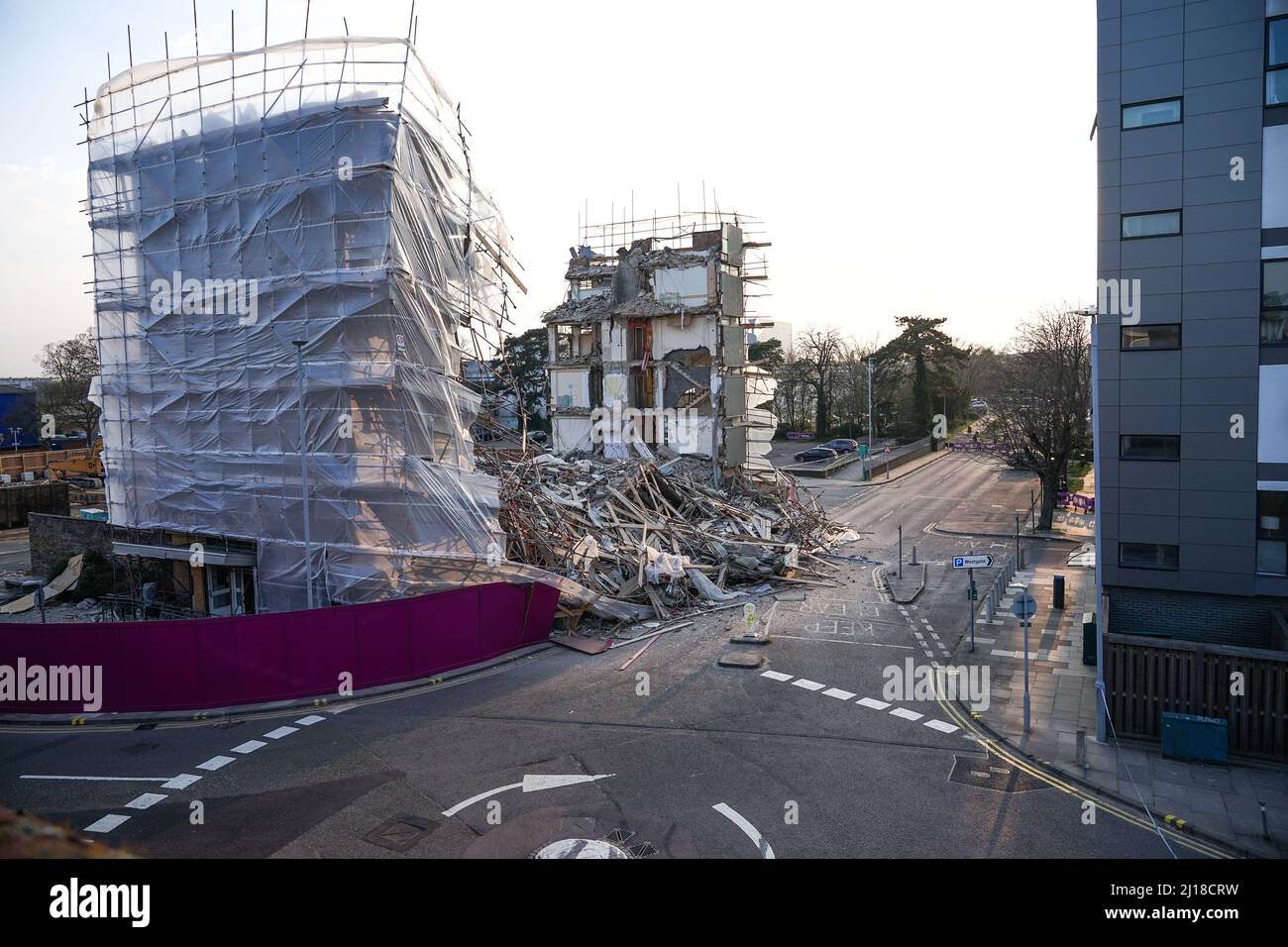 Part of a building in Stevenage collapsed whilst being demolished, leaving debris blocking the street below Stock Photo