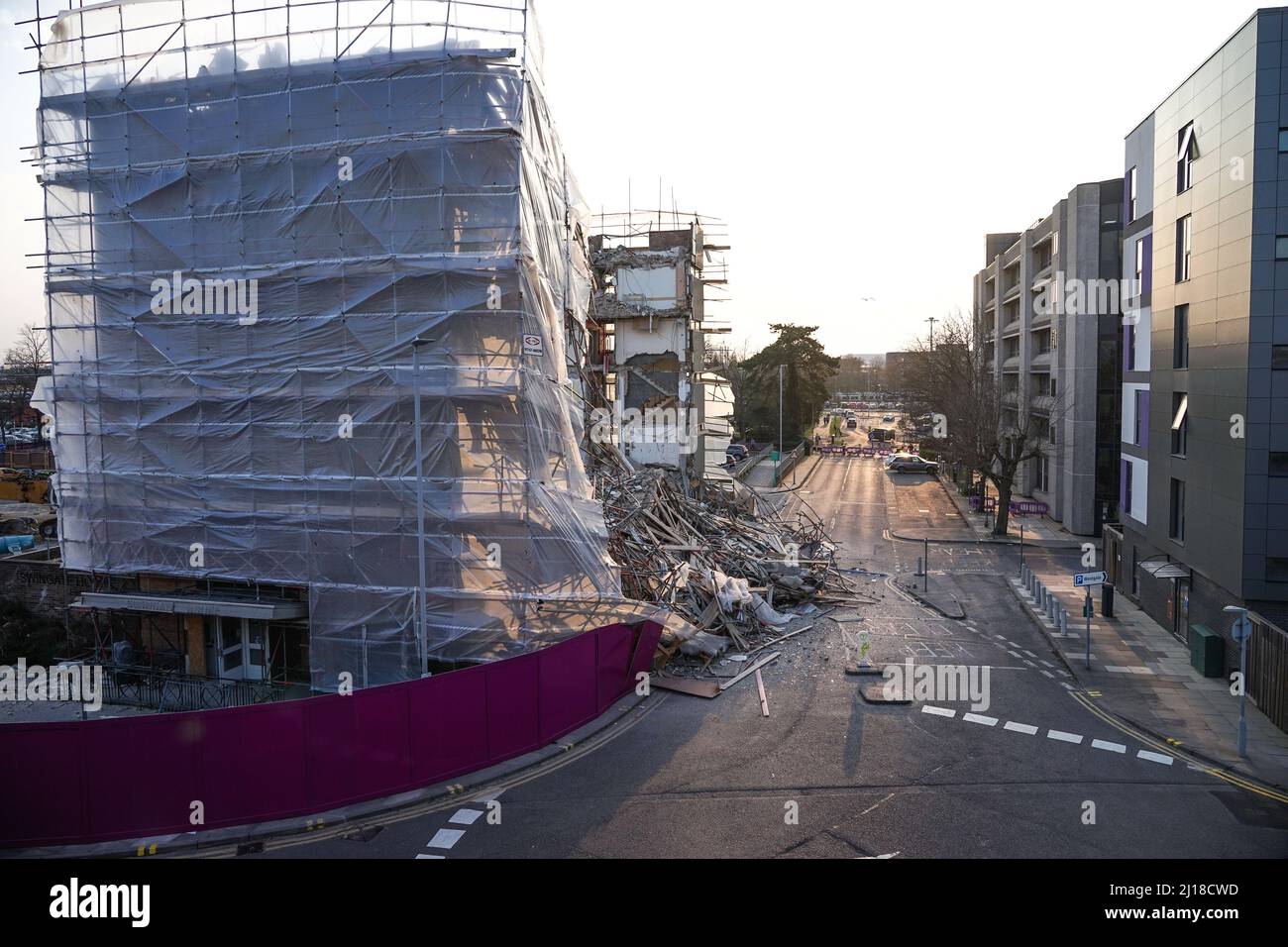 Part of a building in Stevenage collapsed whilst being demolished, leaving debris blocking the street below Stock Photo