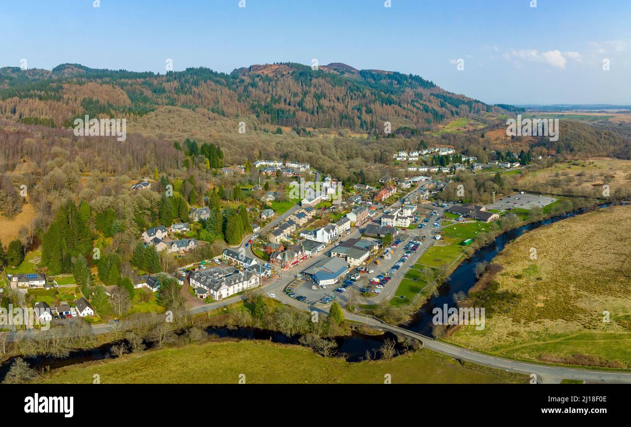 Aerial view from drone of village of Aberfoyle and River Forth in The