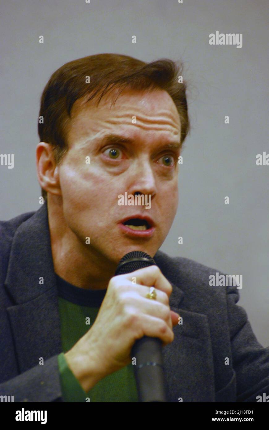 American voice actor comedian, impressionist & musician, Billy West,  demonstrating the facial expressions accompanying the voice of Futurama's Nixon. Stock Photo