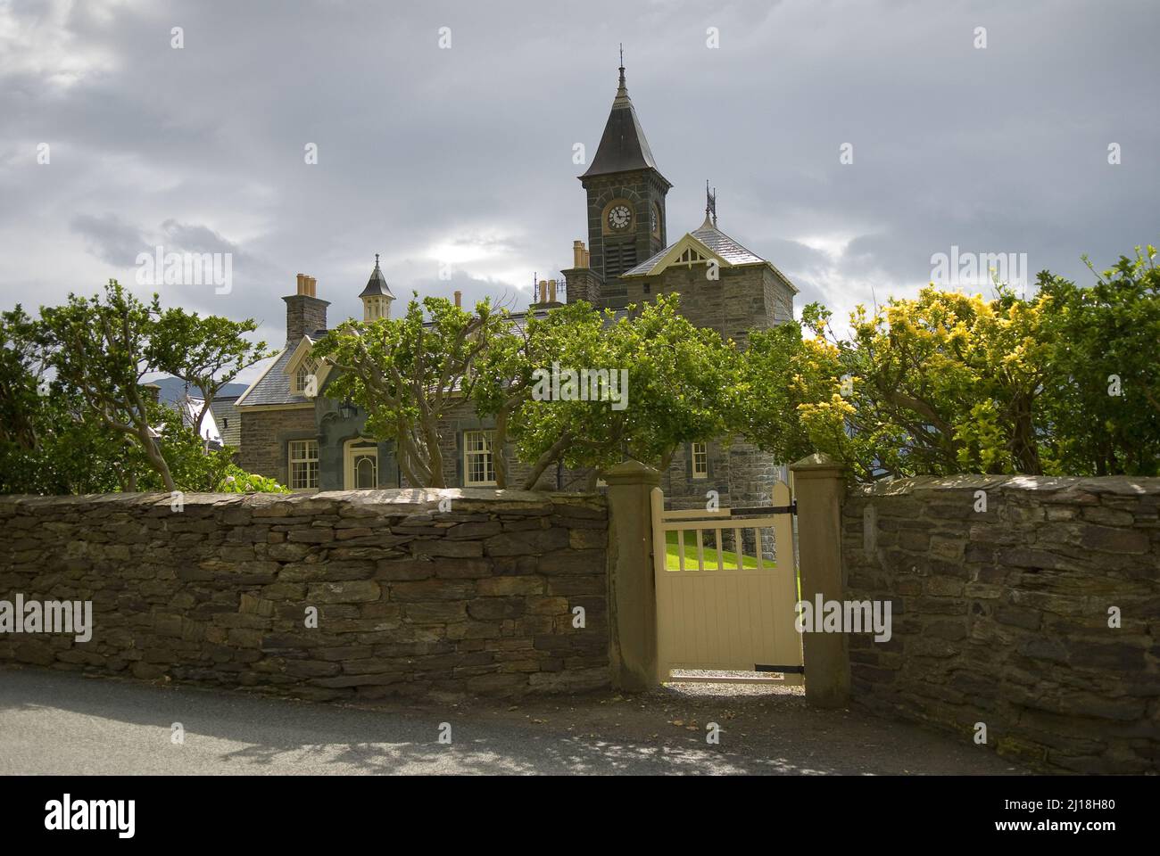 The beautiful old mansion with rich vegetation. Wales, UK Stock Photo