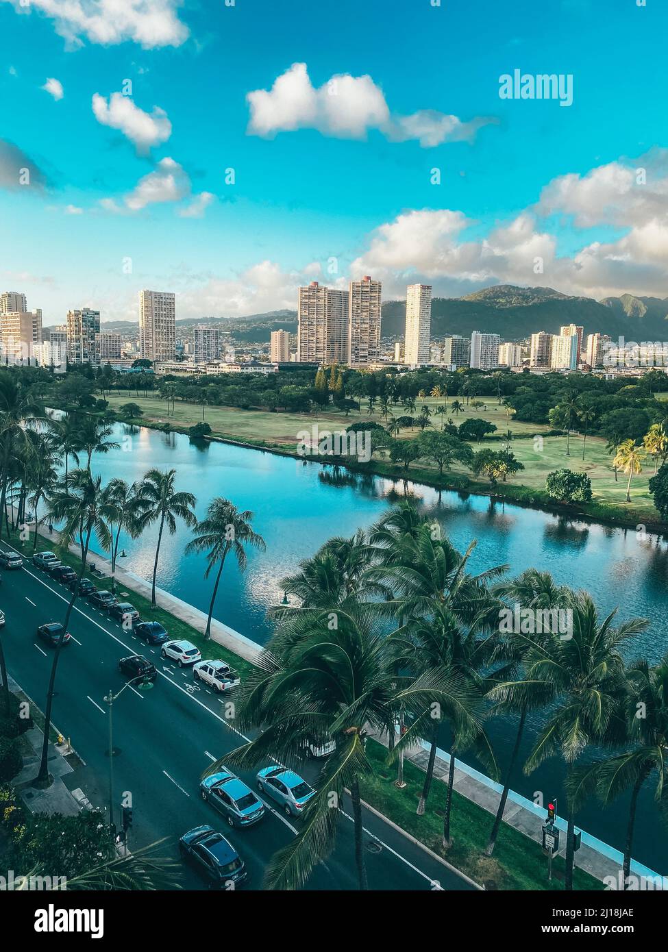 A closeup of a Golf course, street, and waterway in Honolulu, Hawaii on Oahu Stock Photo