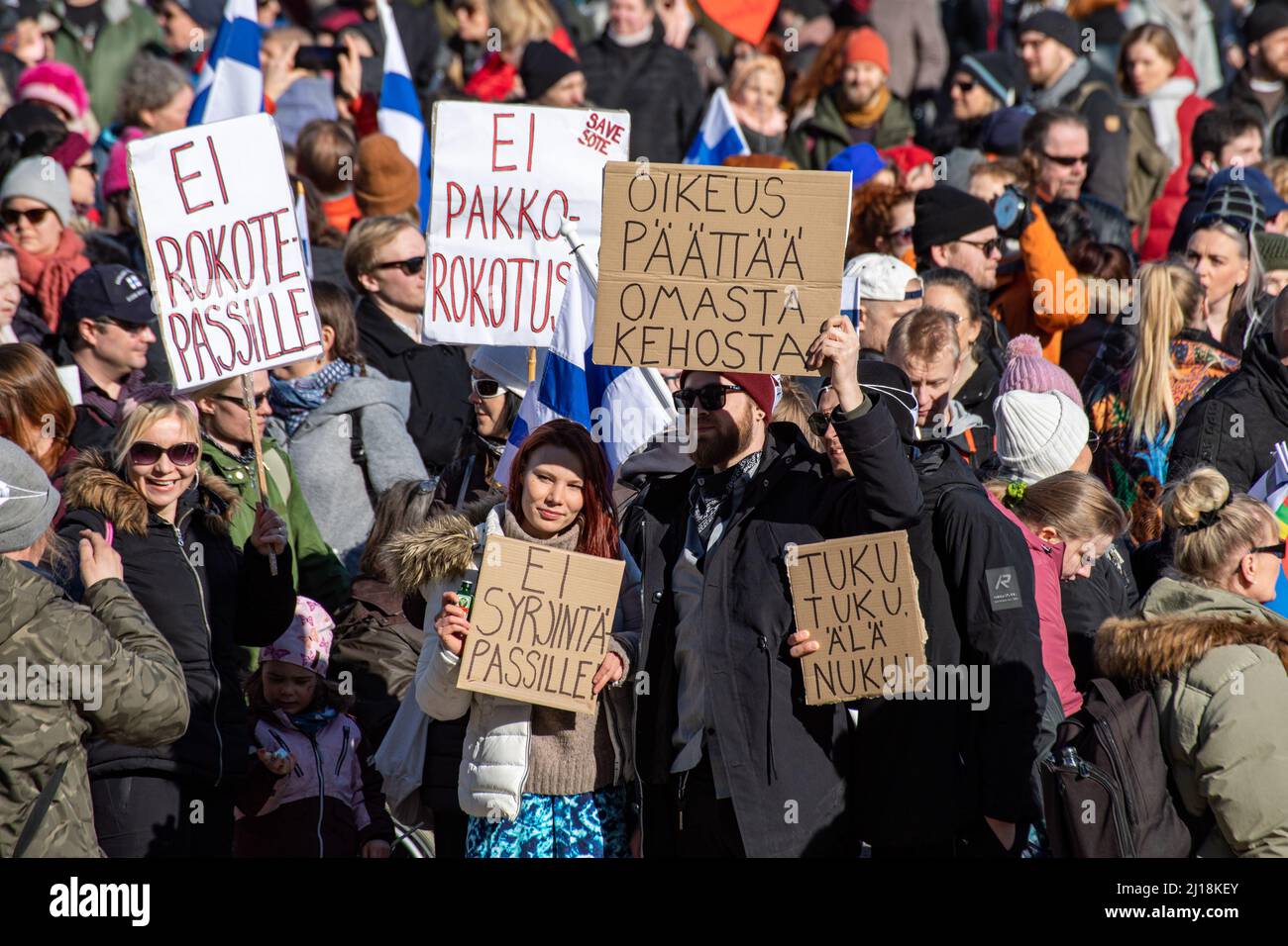 Anti-vaccination protesters with signs at Worldwide Demonstration 7.0 on Senate Square or Senaatintori in Helsinki, Finland Stock Photo