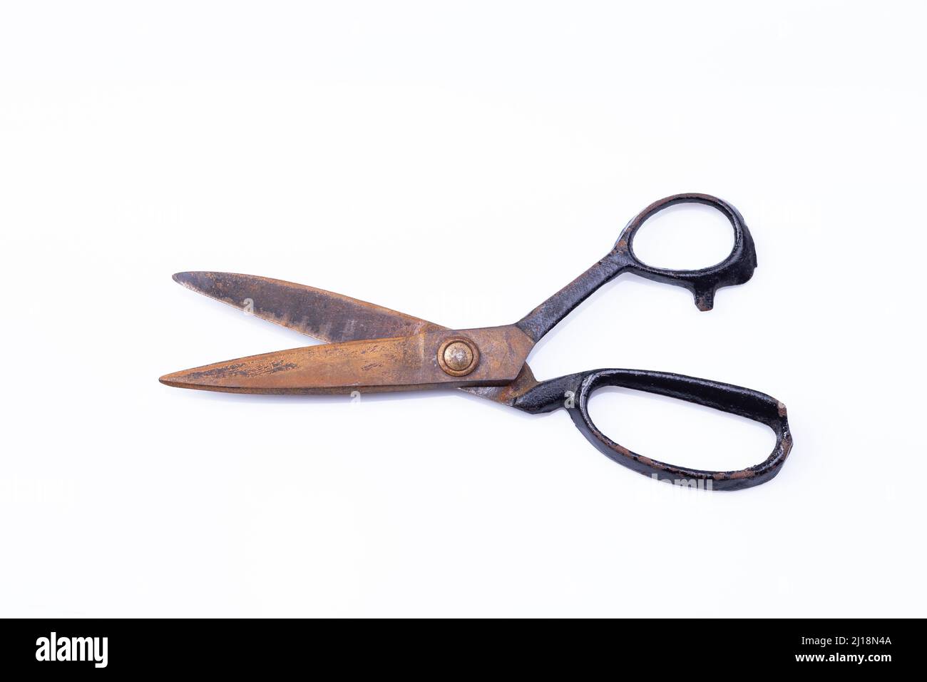 The photo shows an old rusty scissors on white background Stock Photo