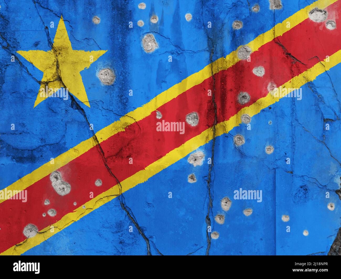 Full frame photo of a weathered flag of Democratic Republic of the Congo painted on a cracked wall with bullet holes. Violence in Congo concept. Stock Photo
