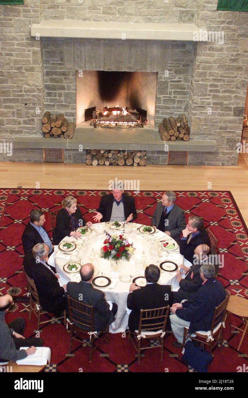 Shepherdstown, West Virginia - January 9, 2000 -- United States President Clinton, top center, hosts a Mideast peace talks dinner meeting between Prime Minister Ehud Barak of Israel, left, and Foreign Minister Farouk al-Sharaa of Syria, top right, and others in Shepherdstown, West Virginia, on 9 January 2000. U.S. Secretary of State Madeleine Albright is at top left and National Security Adviser Samuel Berger is at right. This was the third face-to-face meeting between Barak and al-Sharaa during the peace talks. Mandatory Credit: White House via CNP/Sipa USA Stock Photo