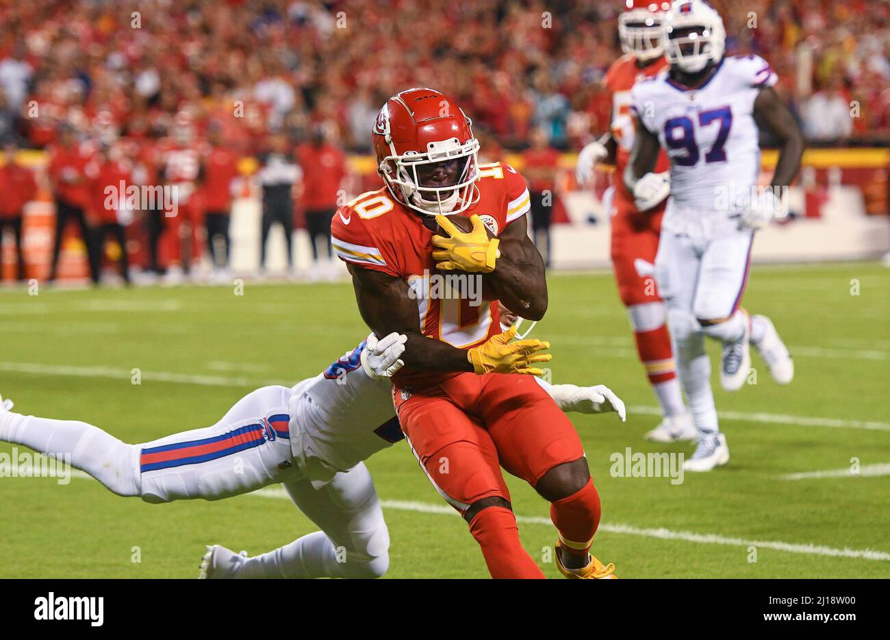 Kansas City, USA. 10th Oct, 2021. Kansas City Chiefs wide receiver Tyreek Hill fights for yardage in the first quarter while in the grasp of a Buffalo Bills defender Sunday, Oct. 10, 2021, at Arrowhead Stadium in Kansas City. (Photo by Tammy Ljungblad/The Kansas City Star/TNS/Sipa USA) Credit: Sipa USA/Alamy Live News Stock Photo