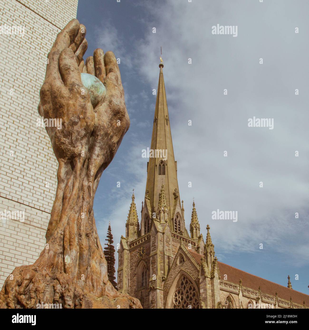 The Tree of Life memorial commemorates the 2,241 victims of the Birmingham Blitz. Seen alongside the spire of St. Martin's church in the Bullring. Stock Photo