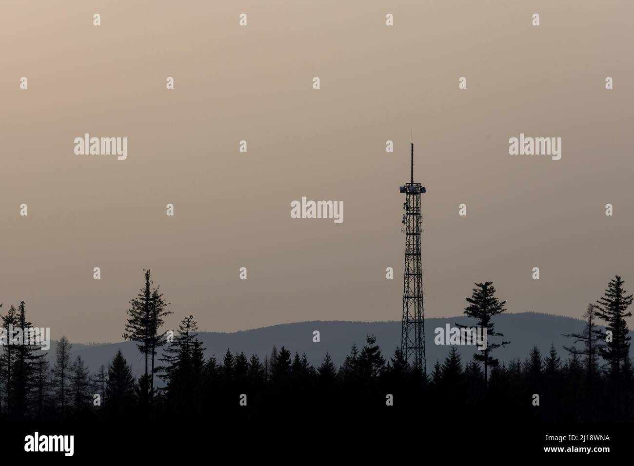 a radio tower in nature silhouette Stock Photo