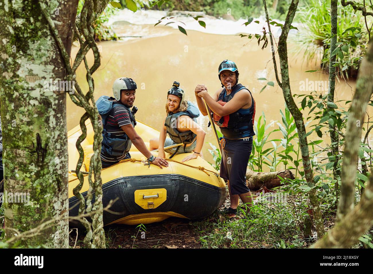 Were ready to have some rafting fun. Shot of a group of friends out ...