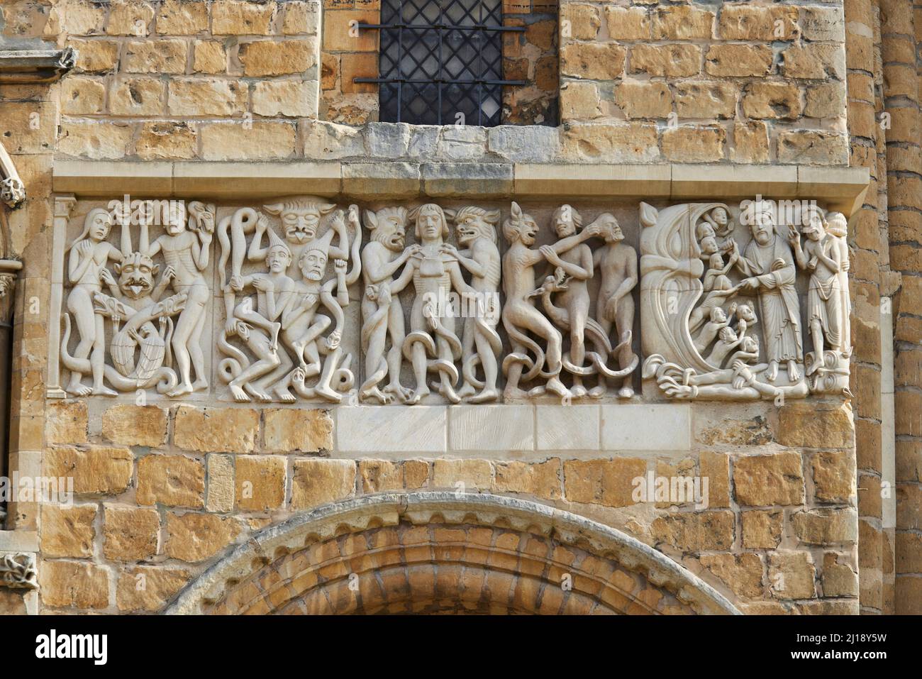 The west front of Lincoln Cathedral is famous for its 12th century carved frieze which runs right across the facade from the northern corner of the we Stock Photo