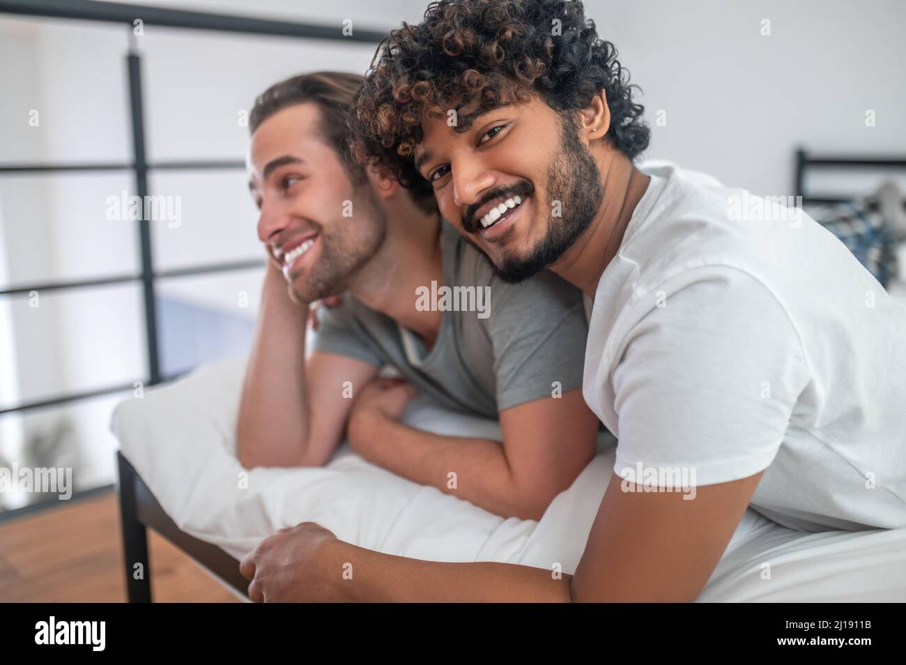 Man in love hugging his happy boyfriend Stock Photo