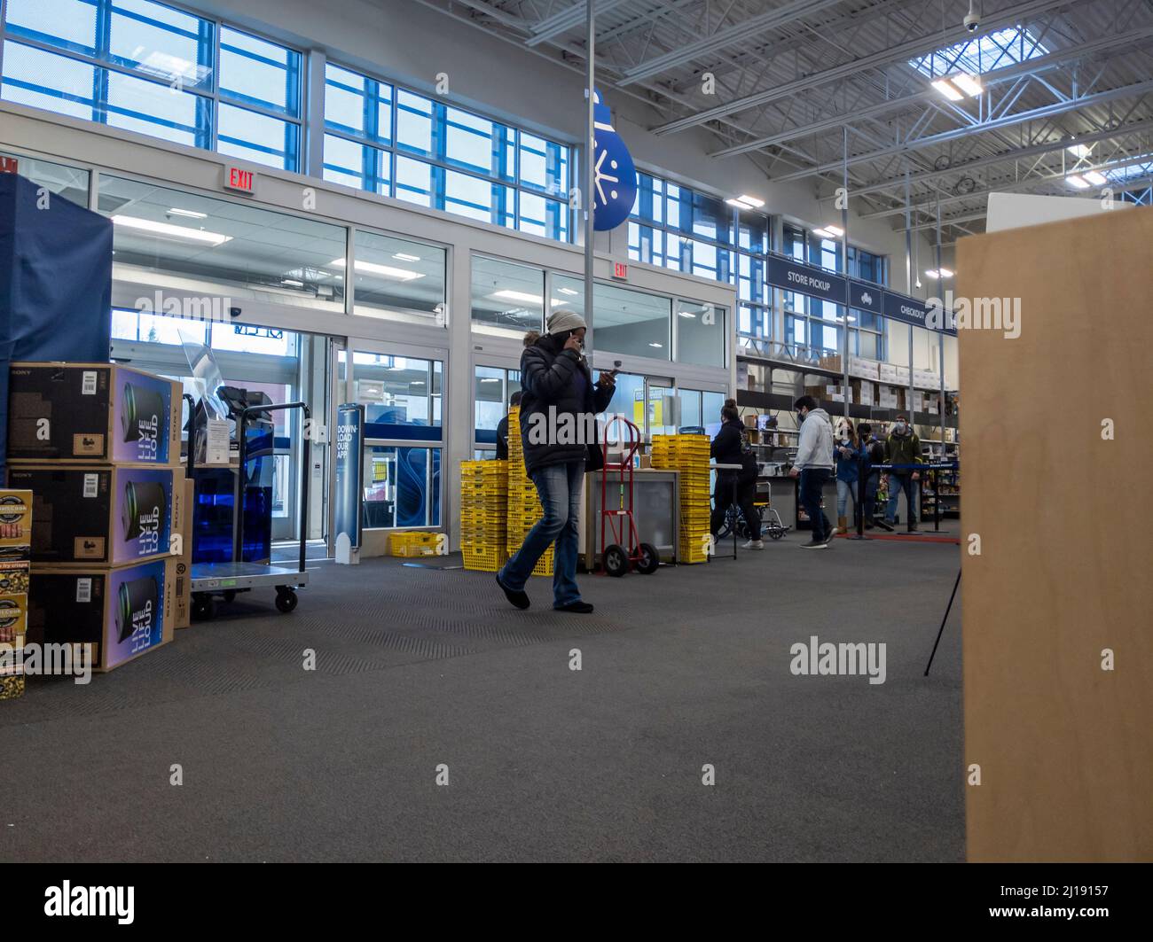 Bellevue, WA USA - circa December 2021: View of an African American woman entering a Best Buy electronics store. Stock Photo