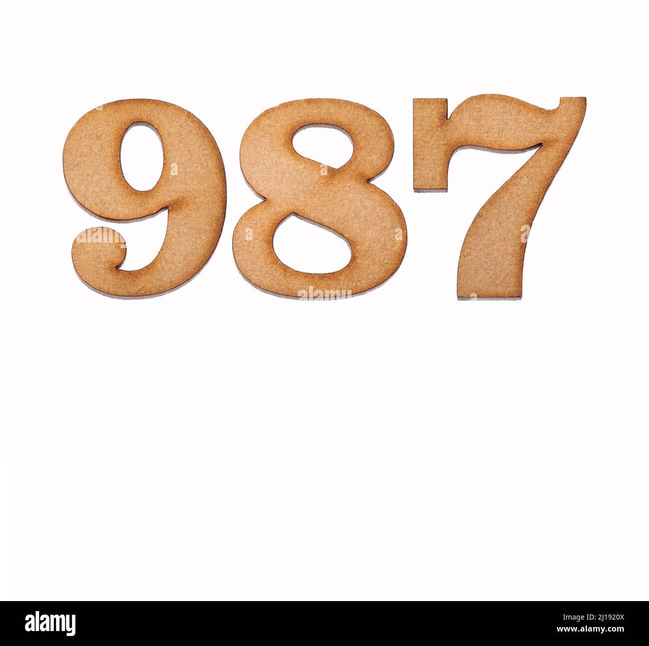 Number 987 in wood, isolated on white background Stock Photo - Alamy