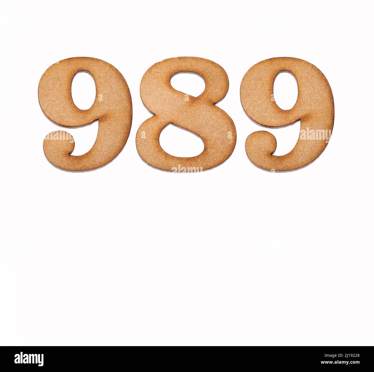 Number 989 in wood, isolated on white background Stock Photo - Alamy