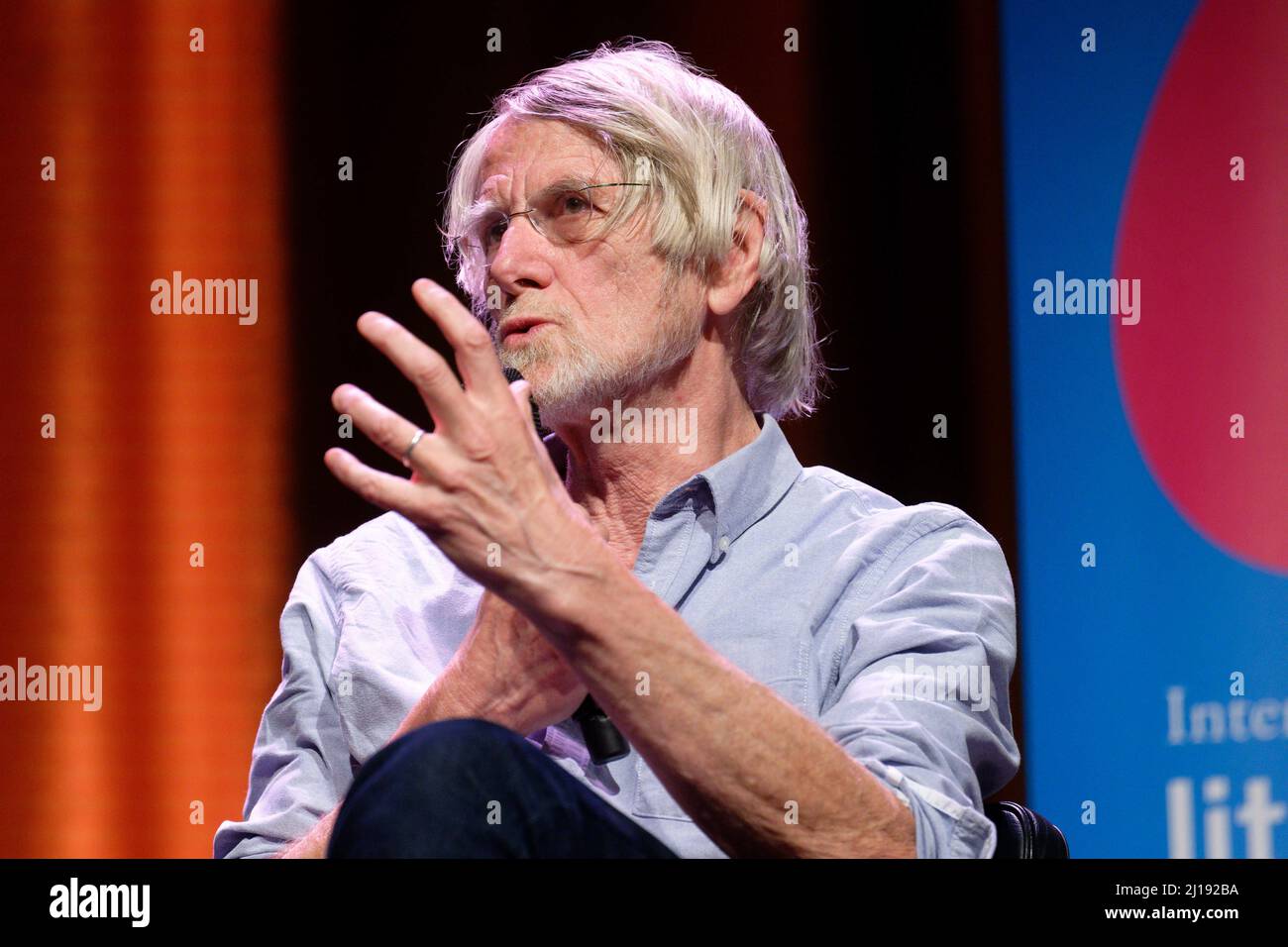 Cologne, Germany. 23rd Mar, 2022. Philosopher Philippe Van Parijs sits on stage at an event as part of the Lit.Cologne literature festival. Credit: Henning Kaiser/dpa/Alamy Live News Stock Photo