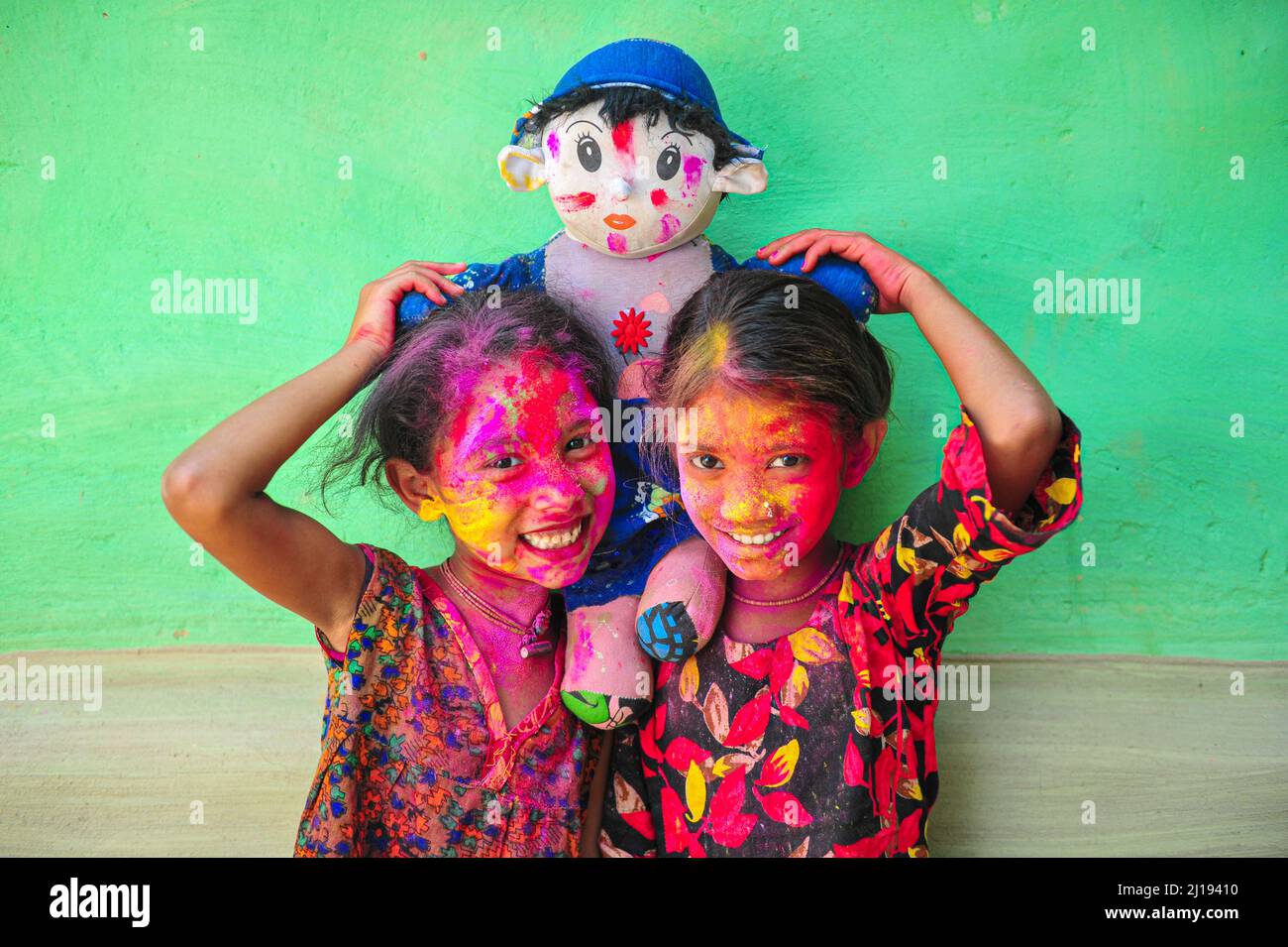Bangladeshi children from Khan Tea garden posing for photos with their faces painted after adorning with colors like Rainbows on the celebration of th Stock Photo