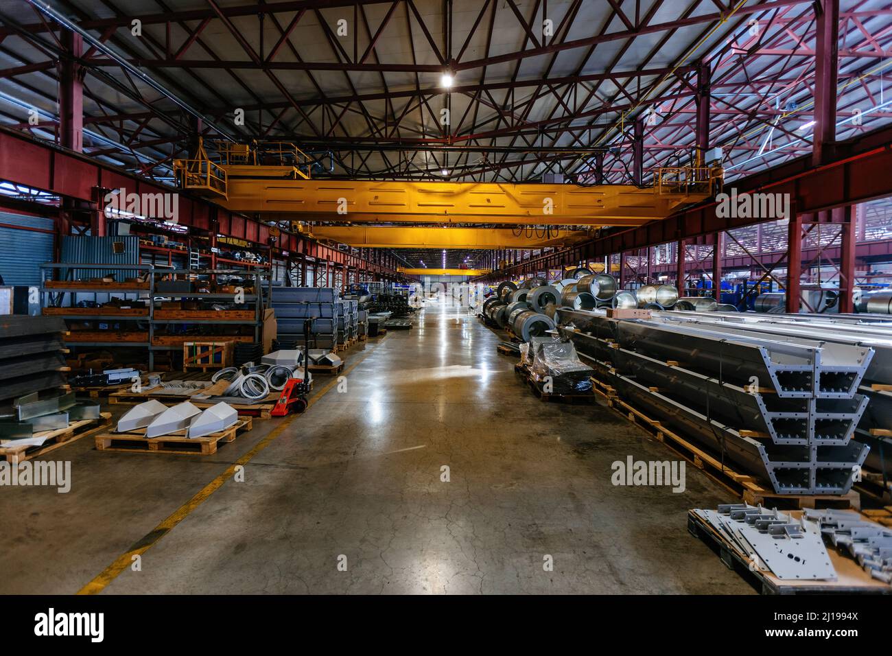 Metalworking factory production line. Rolls of steel and metal profiled ...