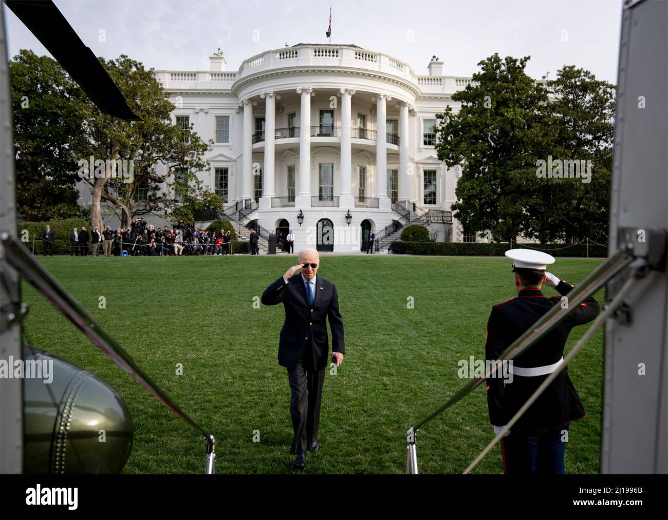 Washington, United States Of America. 23rd Mar, 2022. Washington, United States of America. 23 March, 2022. U.S President Joe Biden salutes as he boards Marine One helicopter to depart from the South Lawn of the White House, March 23, 2022 in Washington, DC Biden is departing on a trip to Brussels and Poland to continue pushing for Ukraine support. Credit: Adam Schultz/White House Photo/Alamy Live News Stock Photo