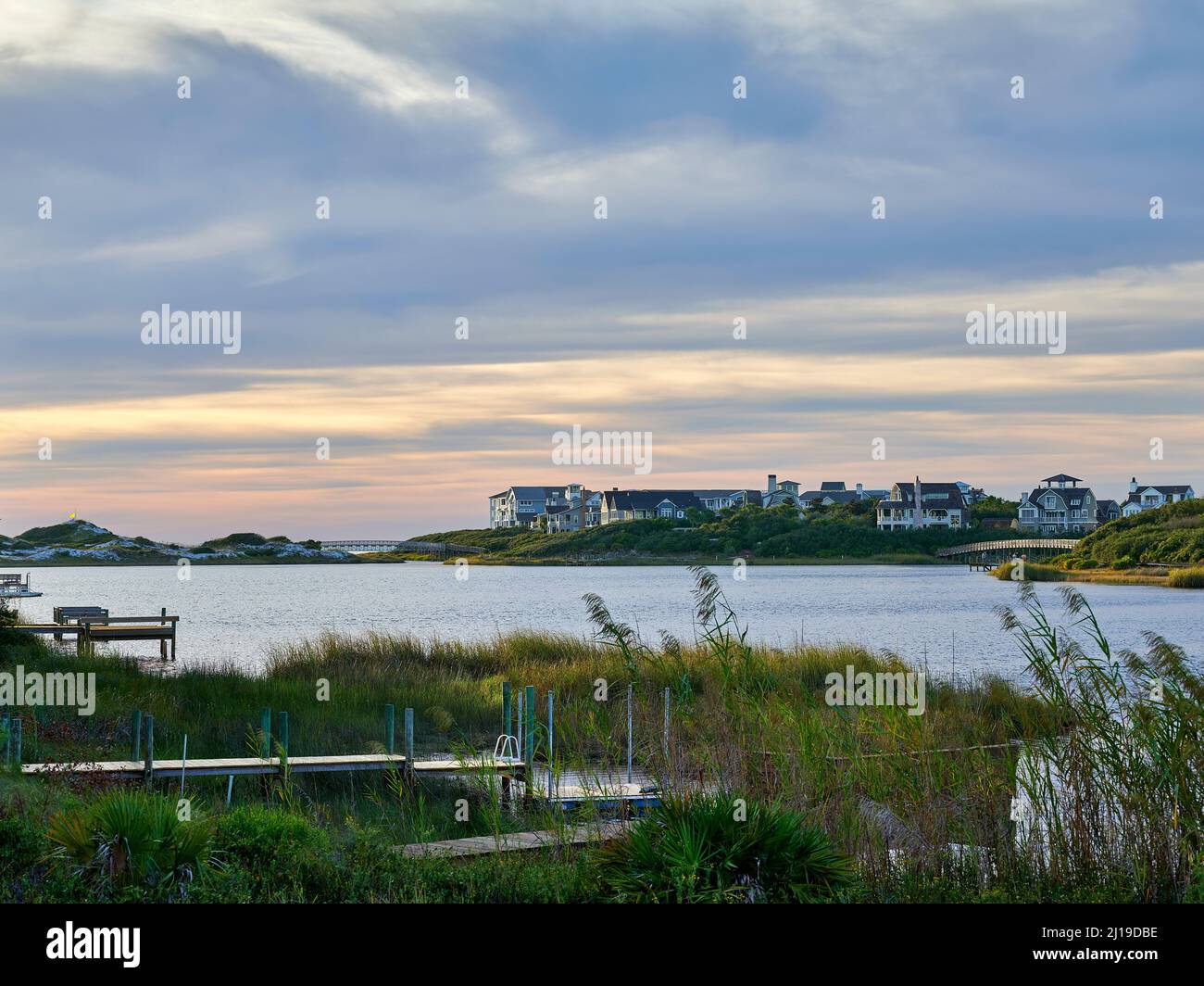 Camp Creek Lake a coastal dune lake with Watersound development in the distance along Scenic Hwy 30a in South Walton County Florida, USA. Stock Photo