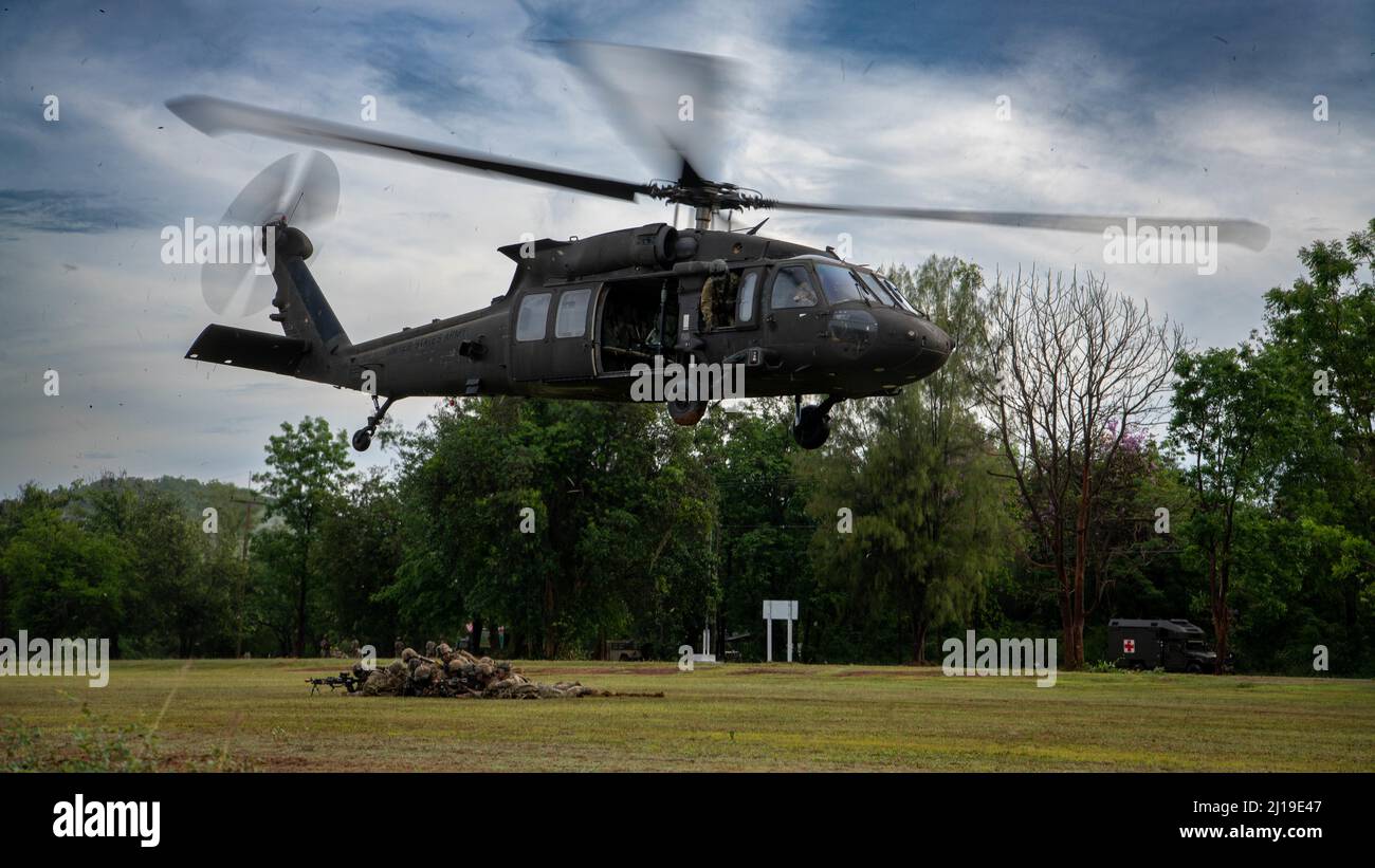 A U.S. Army UH-60 Black Hawks, assigned to the 2nd Assault Helicopter Battalion, 25th Aviation Regiment, 25th Infantry Division, takes-off during an air assault, Mar. 22, 2022, Fort Thanarat, Thailand. Air assaults allow troops to rapidly insert near an objective and utilize the element of surprise during the attack. (U.S. Air Force photo by Tech. Sgt. Michael Mason) Stock Photo