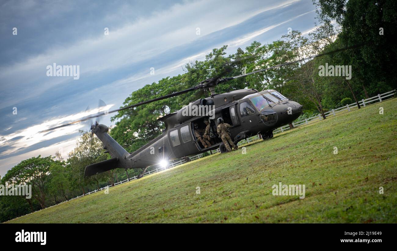 A U.S. Army UH-60 Black Hawk, assigned to the 2nd Assault Helicopter Battalion, 25th Aviation Regiment, 25th Infantry Division, preps for take-off for an air assault, Mar. 22, 2022, Fort Thanarat, Thailand. Air assaults allow troops to rapidly insert near an objective and utilize the element of surprise during the attack. (U.S. Air Force photo by Tech. Sgt. Michael Mason) Stock Photo