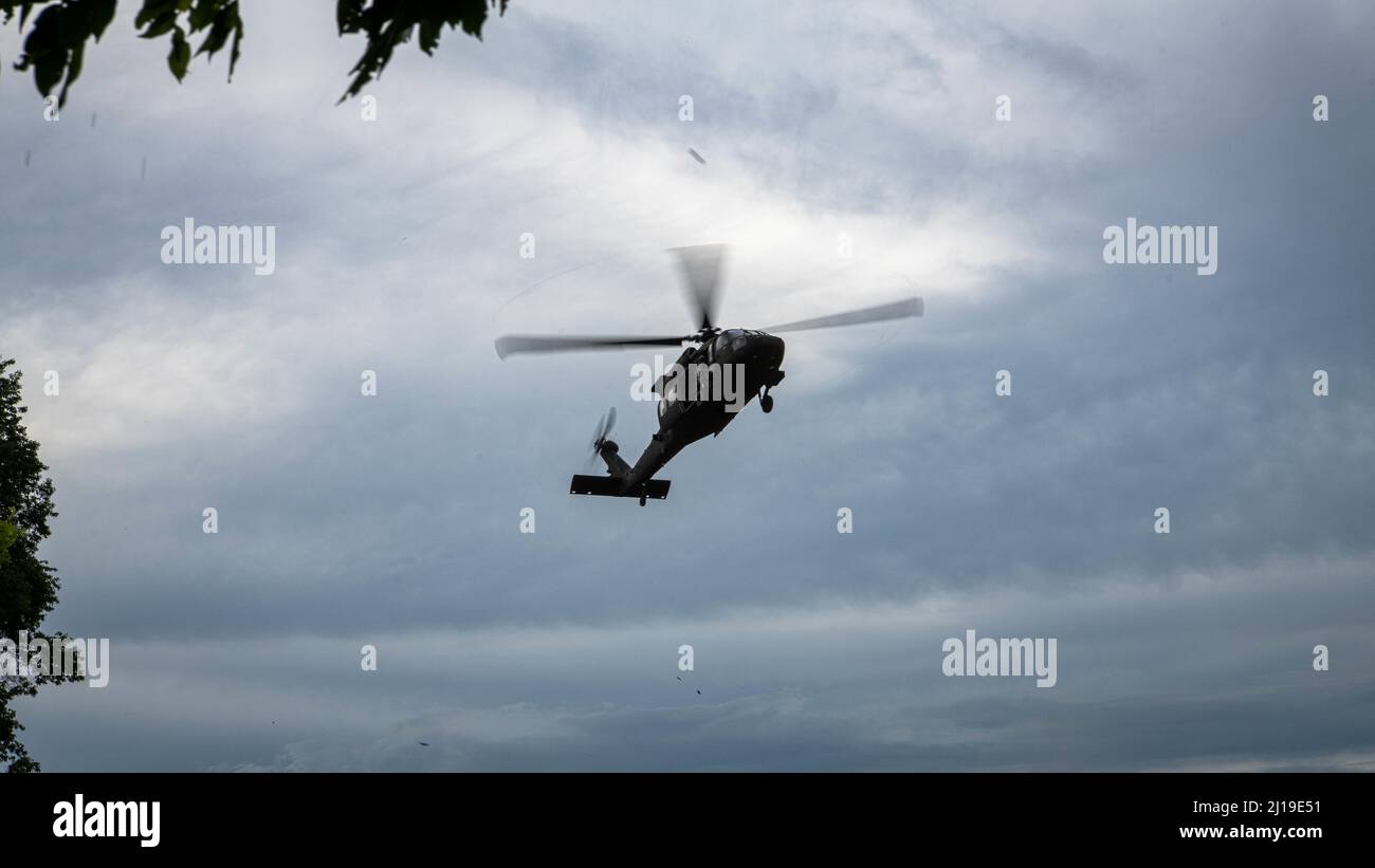 A U.S. Army UH-60 Black Hawk, assigned to the 2nd Assault Helicopter Battalion, 25th Aviation Regiment, 25th Infantry Division, lands to pick up troops from Alpha Company, 29th Brigade Engineer Battalion, 3rd Brigade Combat Team, 25th Infantry Division, for an air assault, Mar. 22, 2022, Fort Thanarat, Thailand. Air assaults allow troops to rapidly insert near an objective and utilize the element of surprise during the attack. (U.S. Air Force photo by Tech. Sgt. Michael Mason) Stock Photo