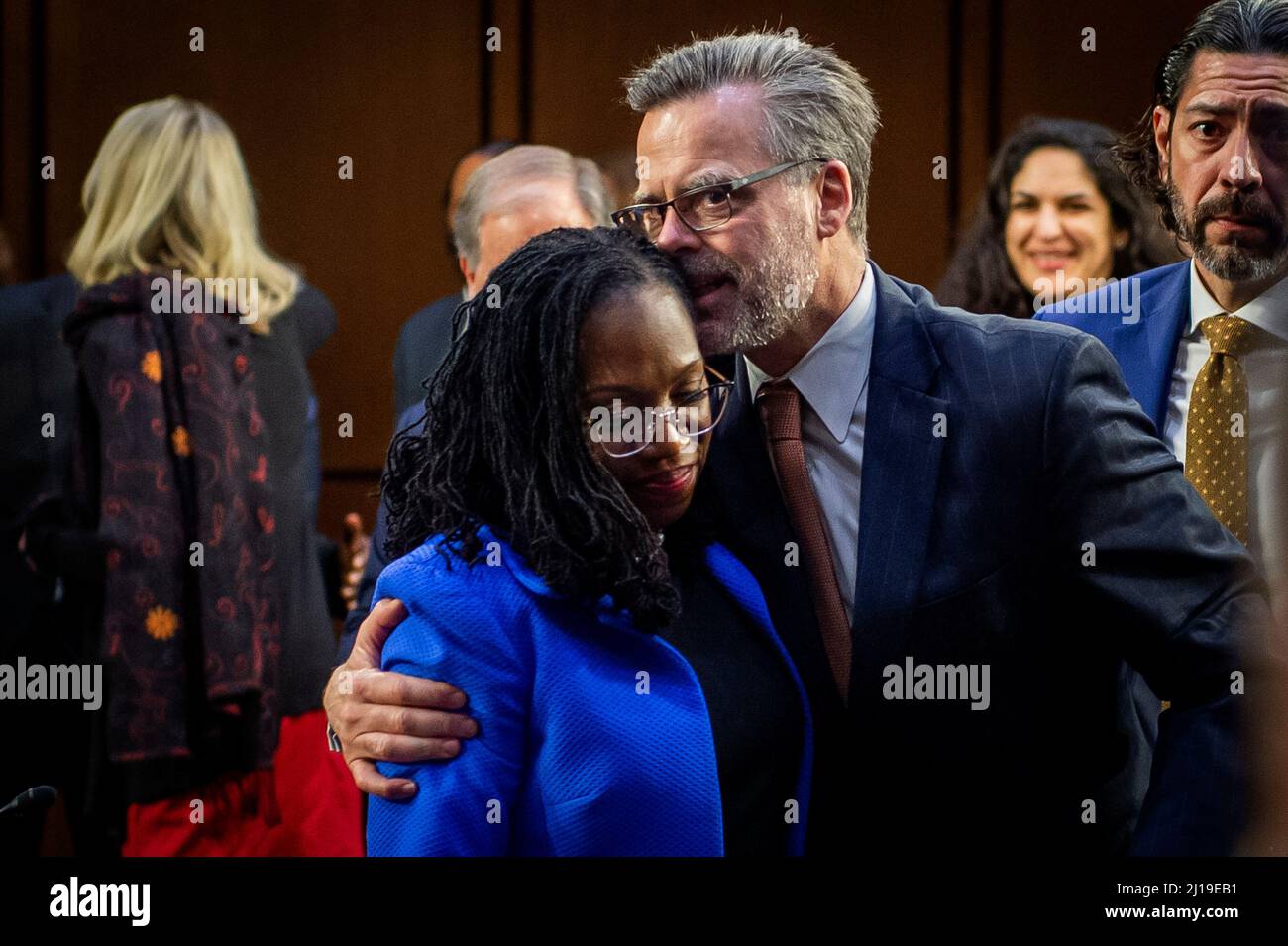 Washington, Vereinigte Staaten. 23rd Mar, 2022. Judge Ketanji Brown Jackson is embraced by her husband Patrick Jackson following the third and final day of her Senate nomination hearings to be an Associate Justice of the Supreme Court of the United States, in the Hart Senate Office Building in Washington, DC, Wednesday, March 23, 2022. Credit: Rod Lamkey/CNP/dpa/Alamy Live News Stock Photo