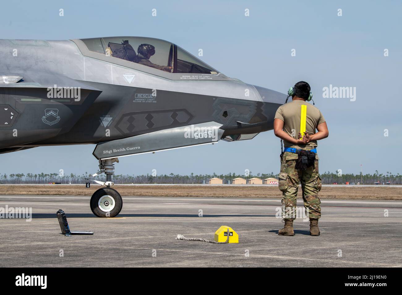 U.S. Air Force Senior Airman Abran Mondragon, 56th Aircraft Maintenance Squadron avionics systems technician, marshals Capt. Jack “Shotgun” Miller, 62nd Fighter Squadron F-35A instructor pilot, both assigned to Luke Air Force Base, Arizona, at Tyndall AFB, Florida, March 3, 2022. The 62nd FS spent approximately two weeks training out of Tyndall to complete part of their student pilot basic course syllabus. (U.S. Air Force photo by Staff Sgt. Betty R. Chevalier) Stock Photo