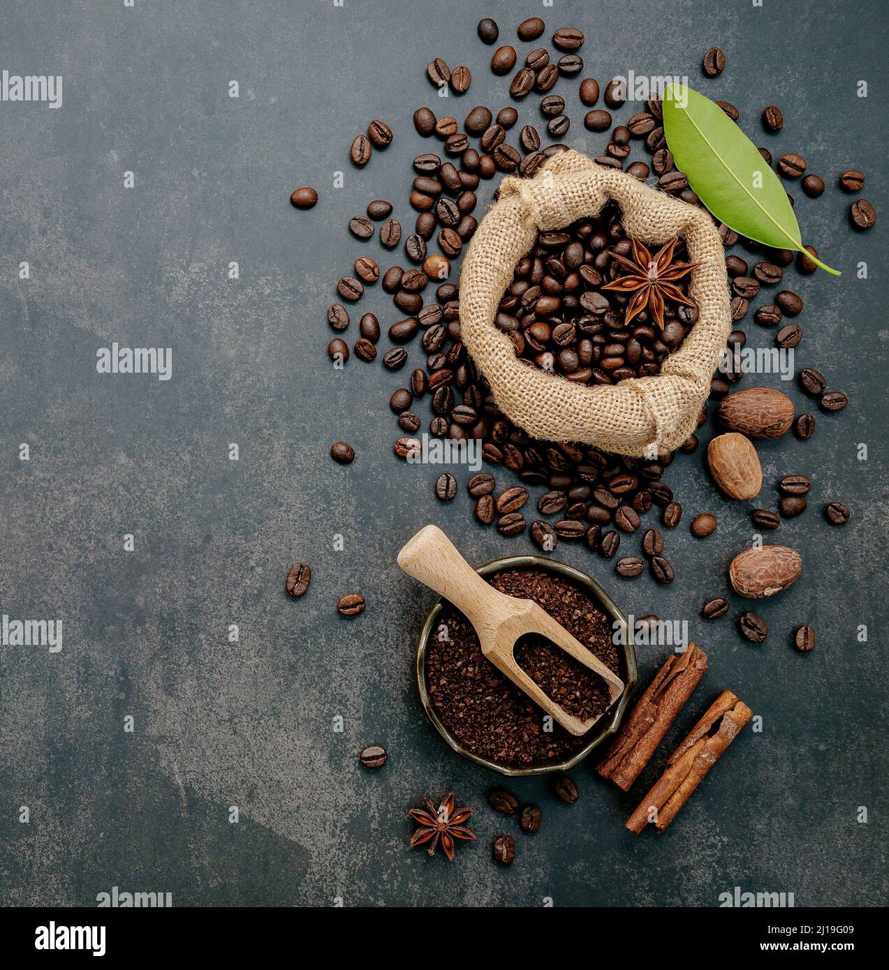 Roasted coffee beans with coffee powder and flavourful ingredients for ...