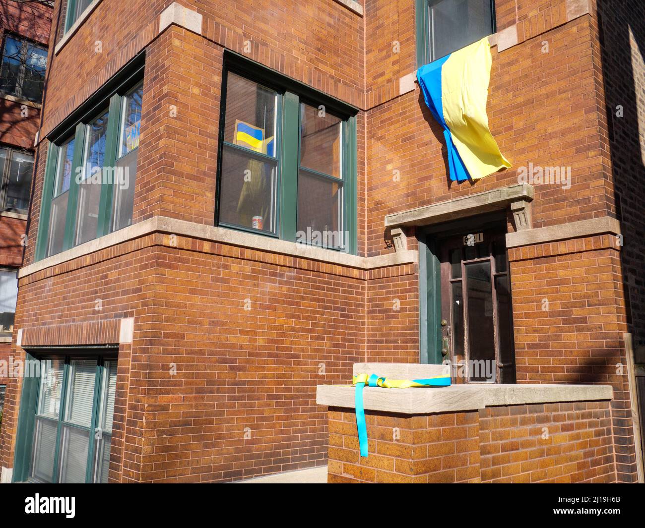 Ukrainian flag and colored ribbon, apartment building in Chicago's Ukrainian Village neighborhood. Stock Photo