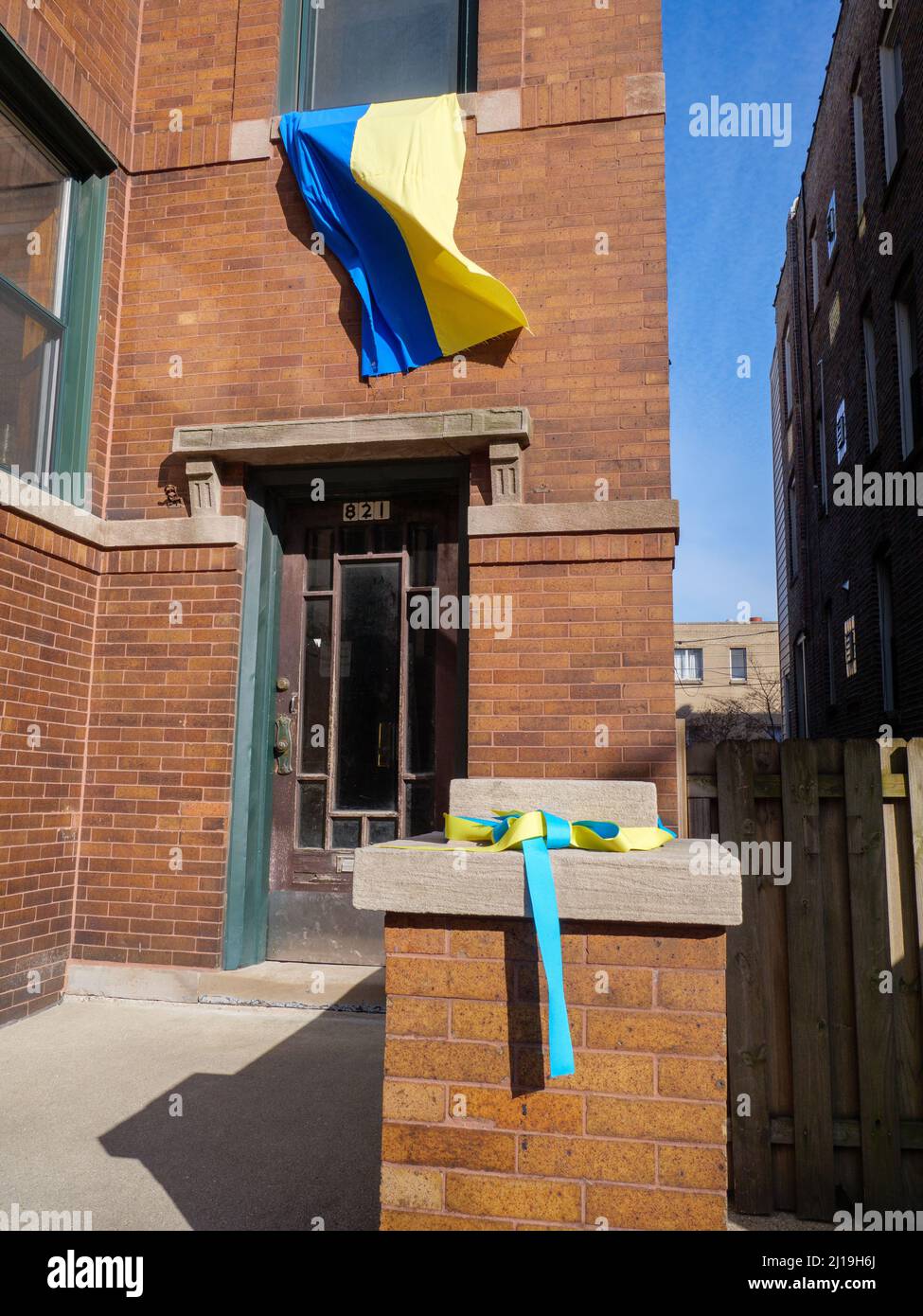 Ukrainian flag and colored ribbon, apartment building in Chicago's Ukrainian Village neighborhood. Stock Photo