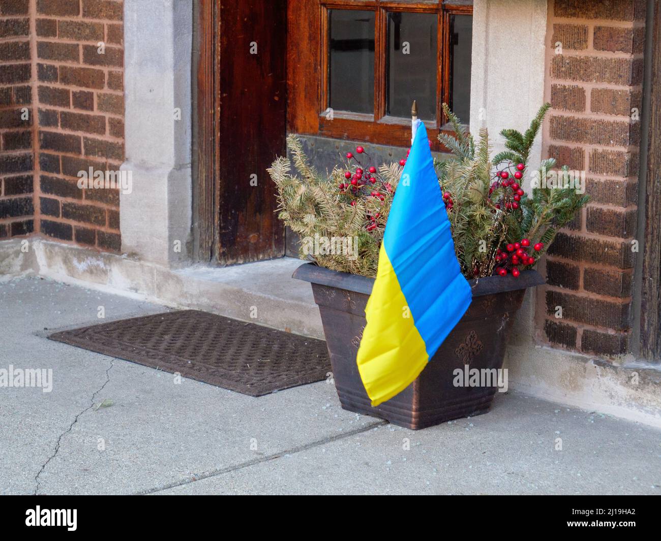 Ukrainian flag in planter outside apartment building door. Ukrainian Village, Chicago, Illinois. Stock Photo
