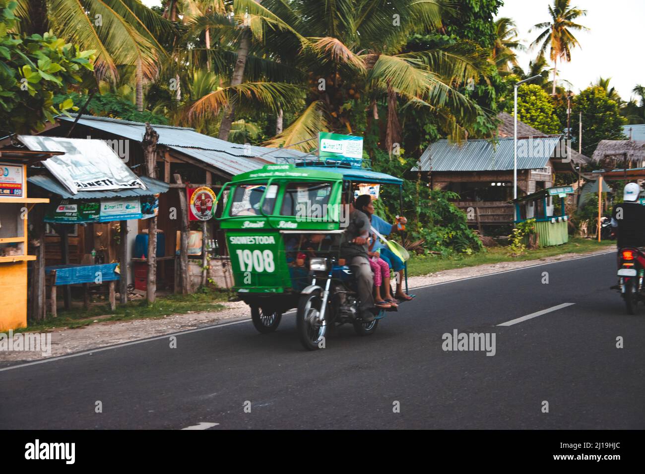 Siquijor Island, Philippines - Decenber 29, 2019: tricycle in front of a simple gas station in the Philippines Stock Photo