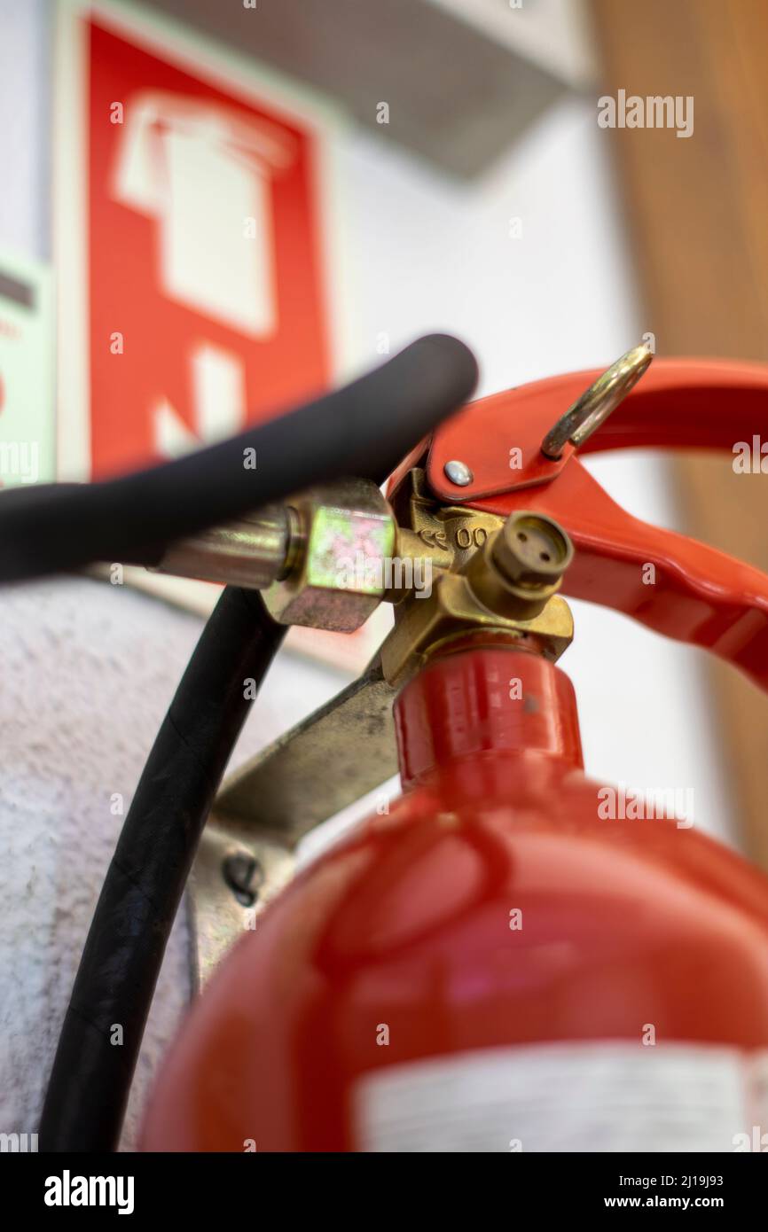 Fire extinguisher placement indoor. Fire extinguisher sticker. Stock Photo