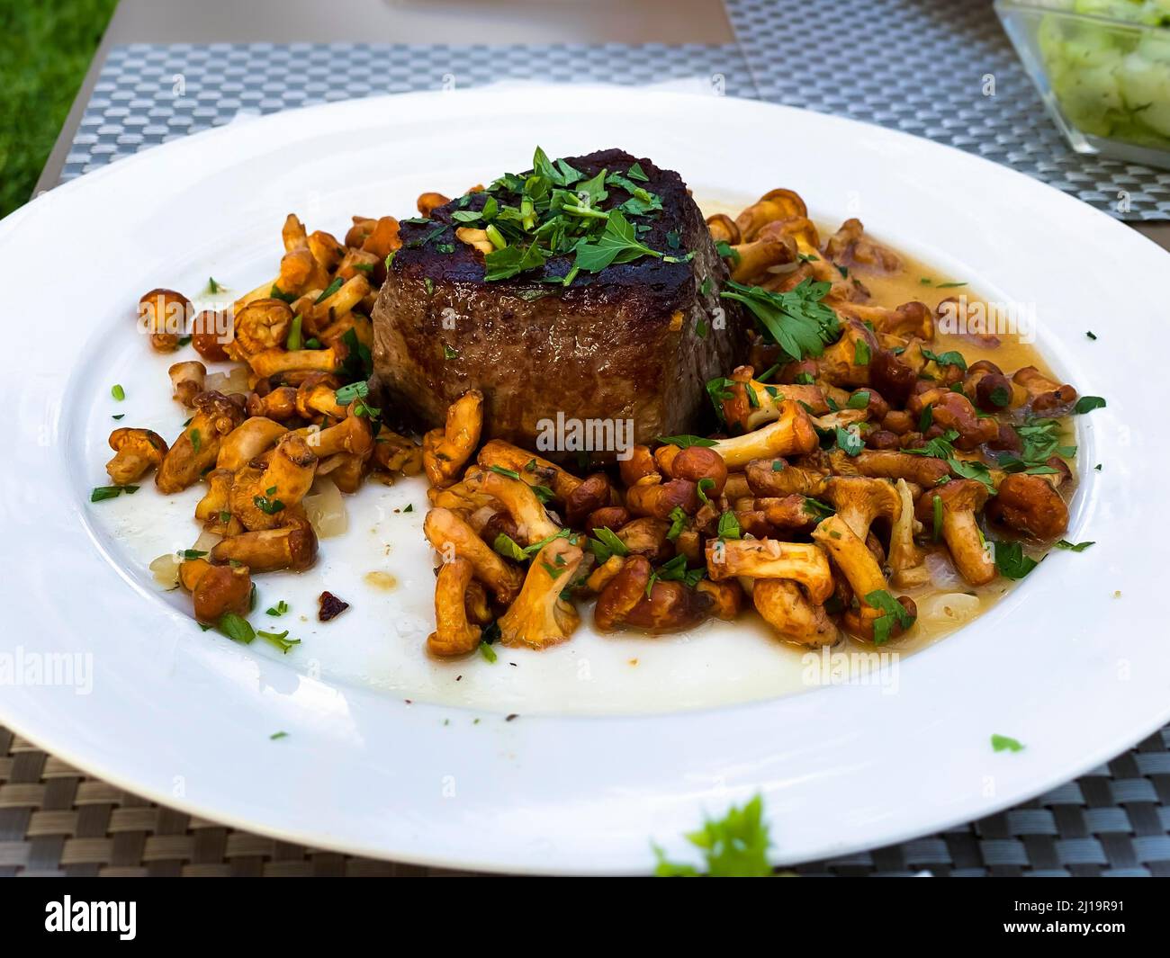 Fillet steak with chanterelles and parsley Stock Photo