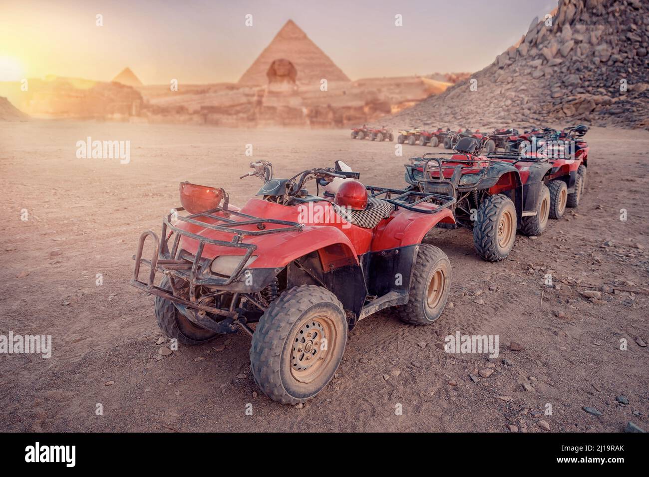 Quad bikes ATV safari in desert background Pyramids Sphinx Cairo, Egypt